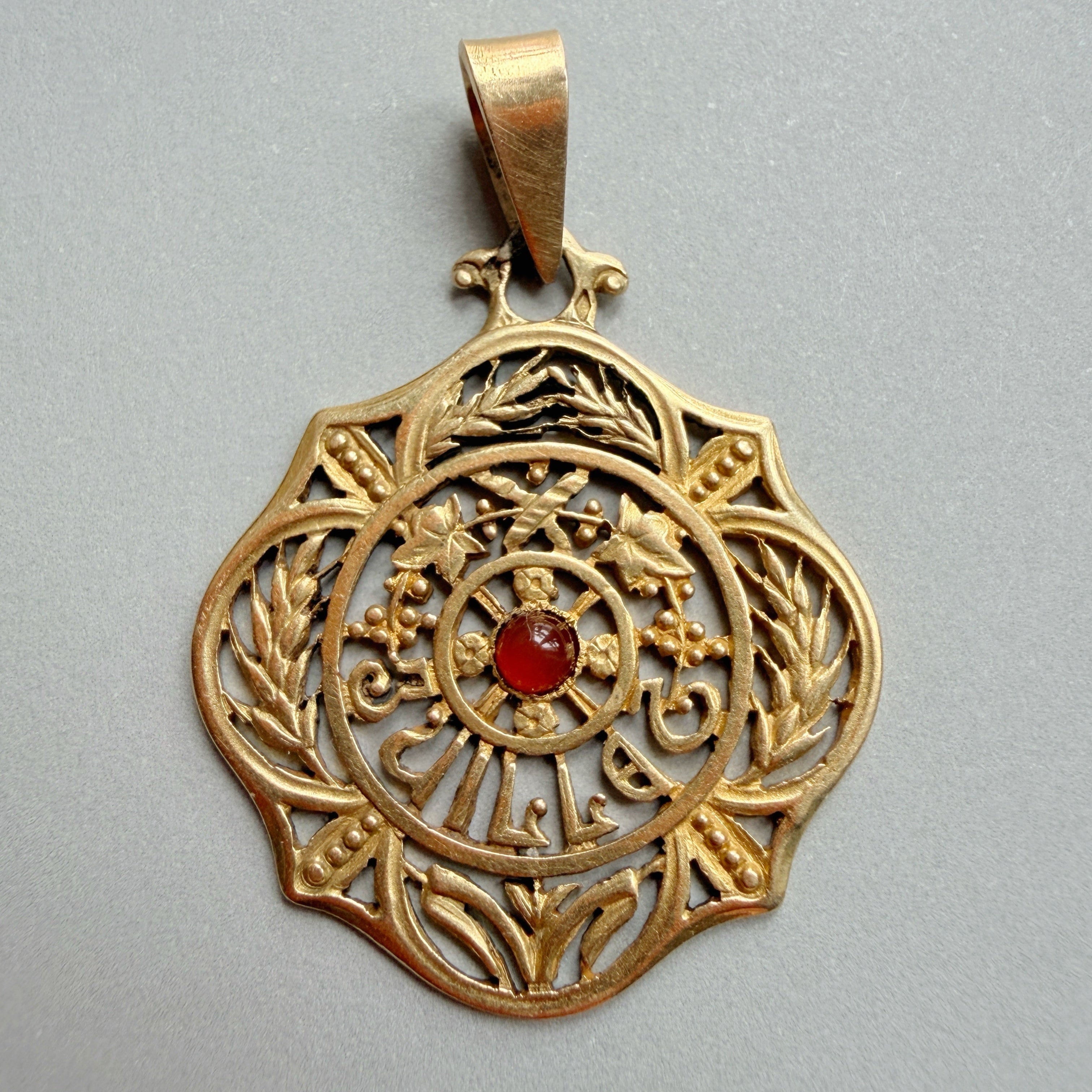 Art Nouveau era 18K gold “July” medal pendant