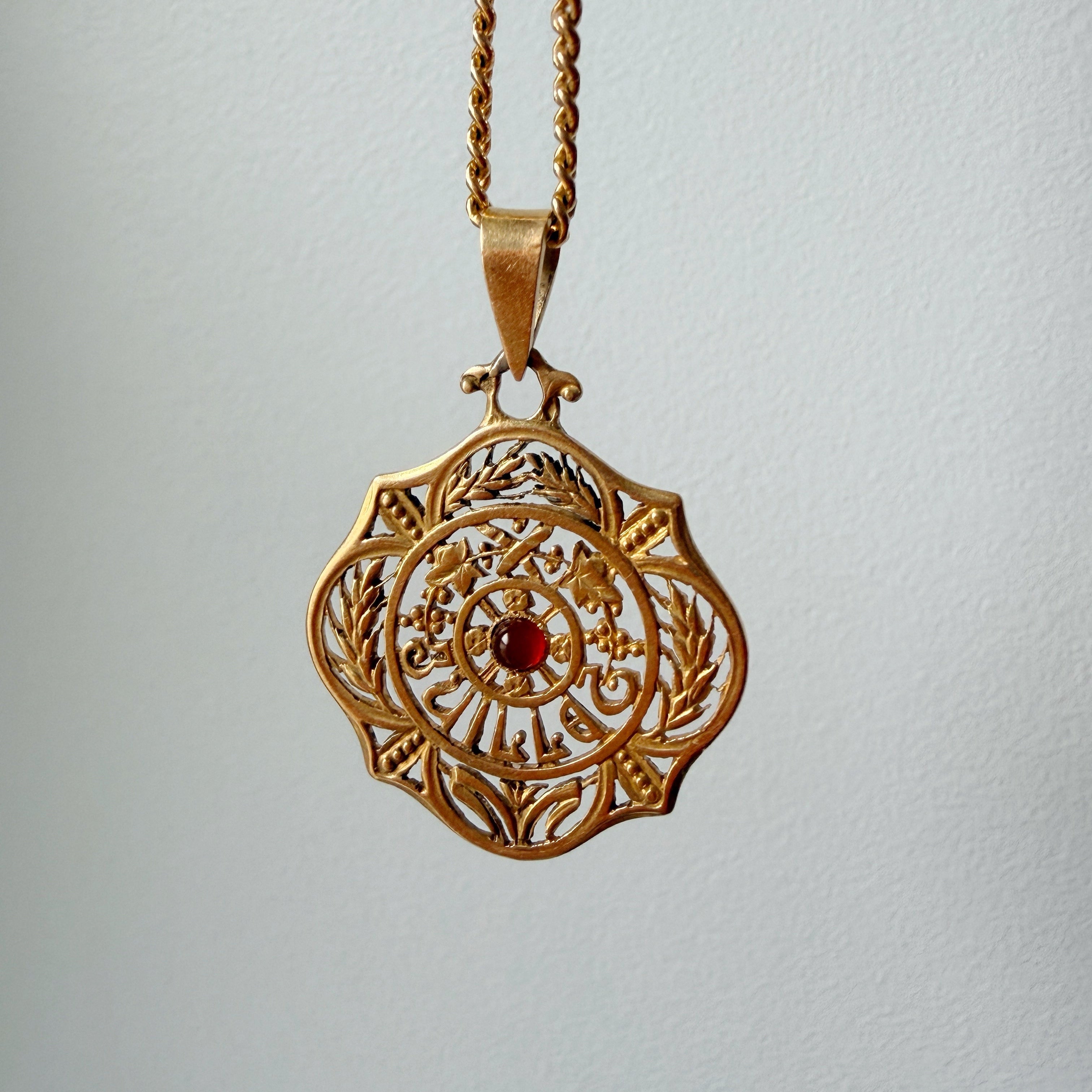 Art Nouveau era 18K gold “July” medal pendant