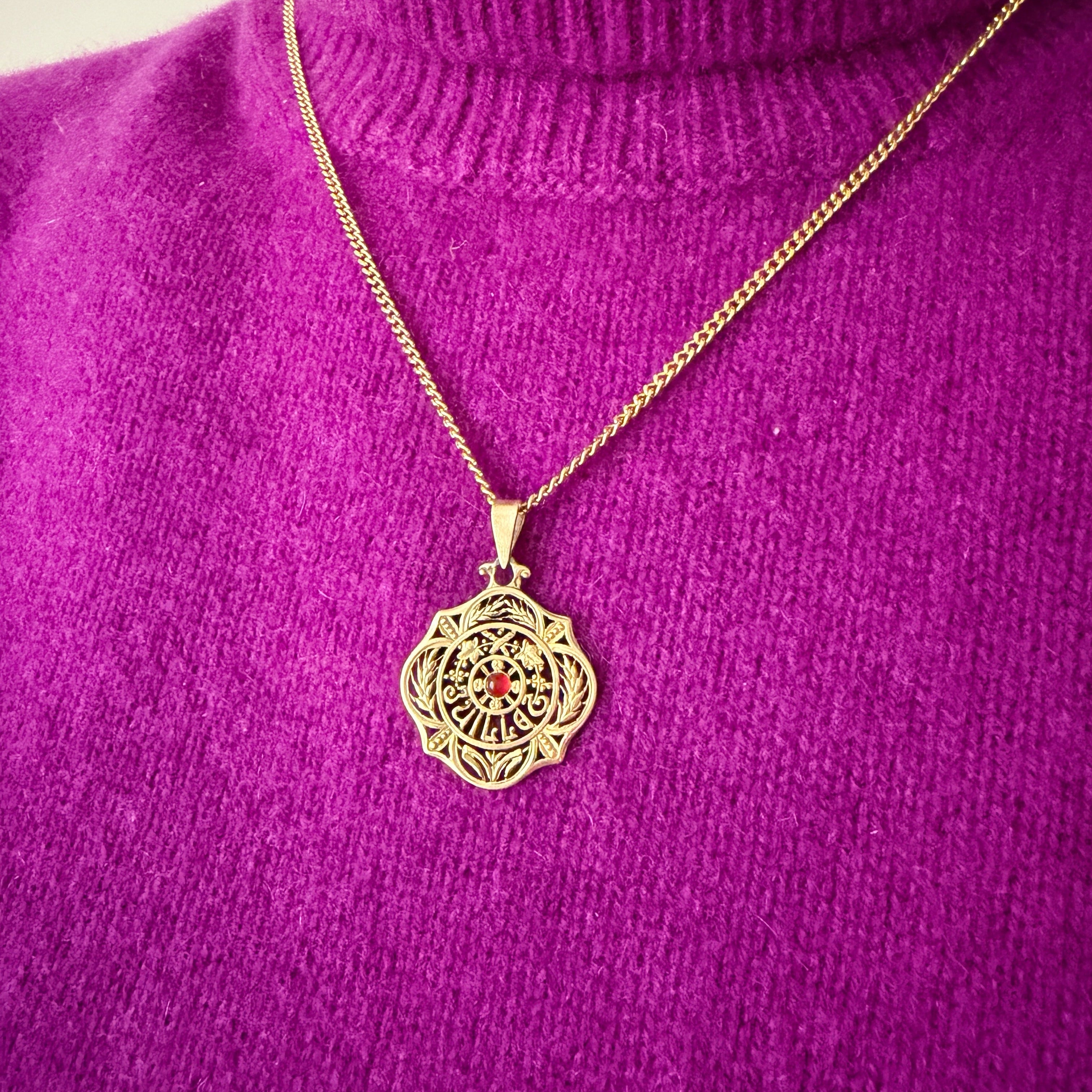 Art Nouveau era 18K gold “July” medal pendant