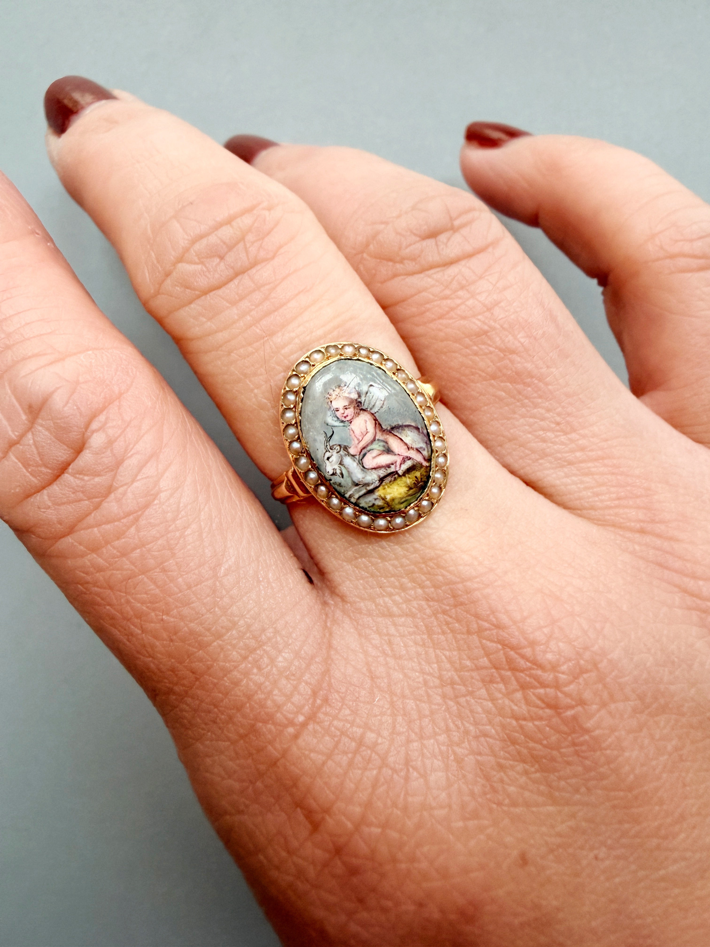 Victorian era 18K gold cherub riding a goat pearl ring