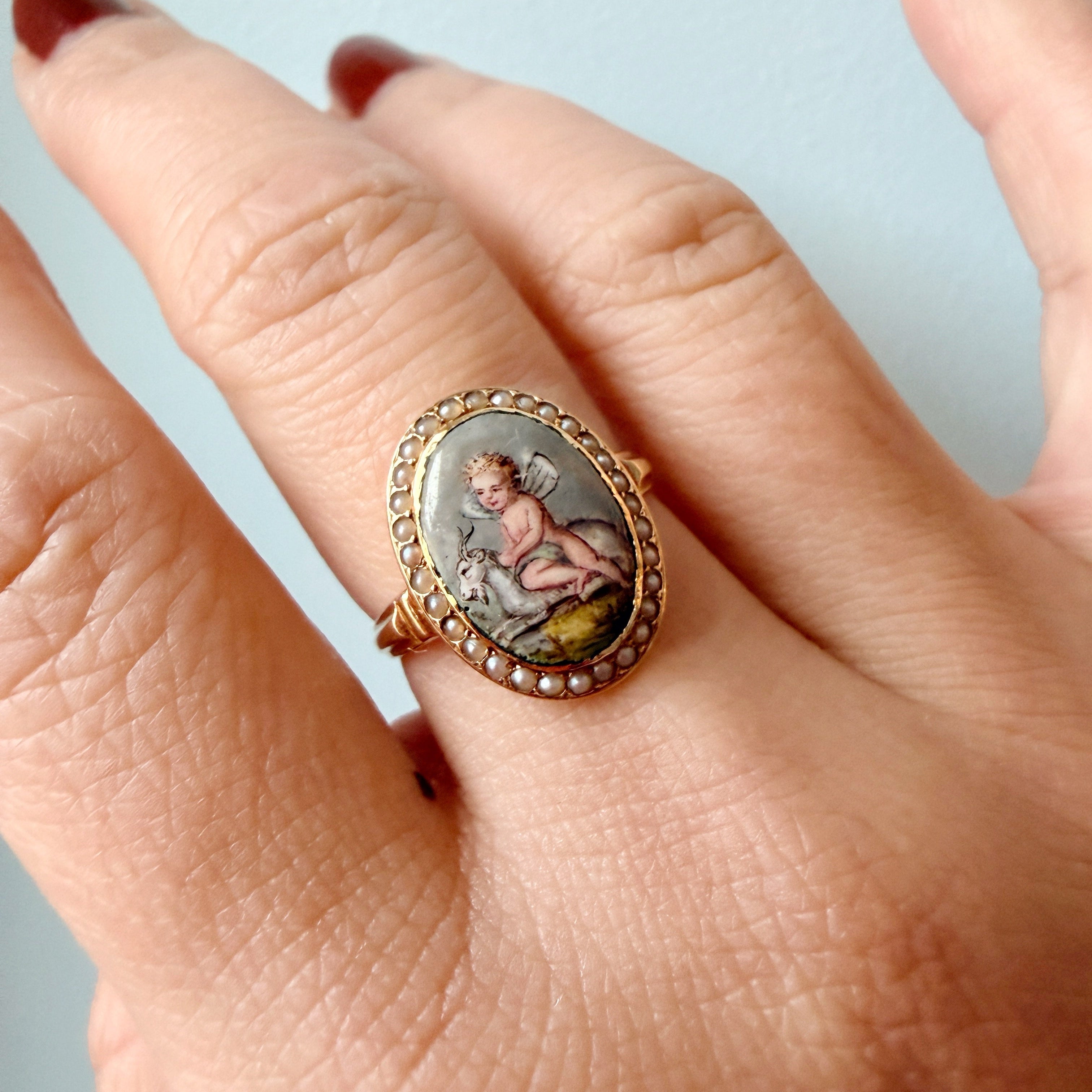 Victorian era 18K gold cherub riding a goat pearl ring