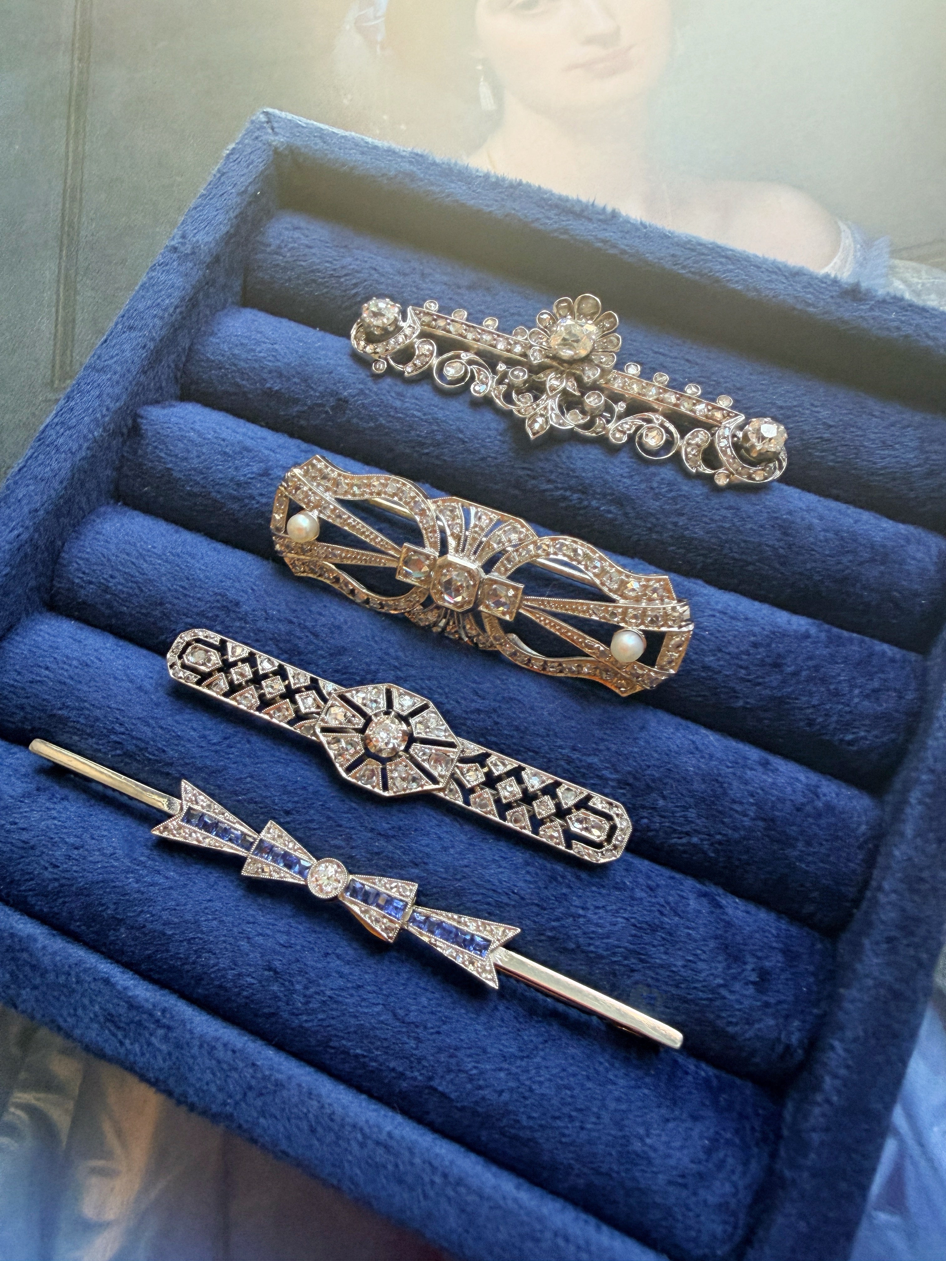 Art Deco 18K gold diamond sapphire bow brooch