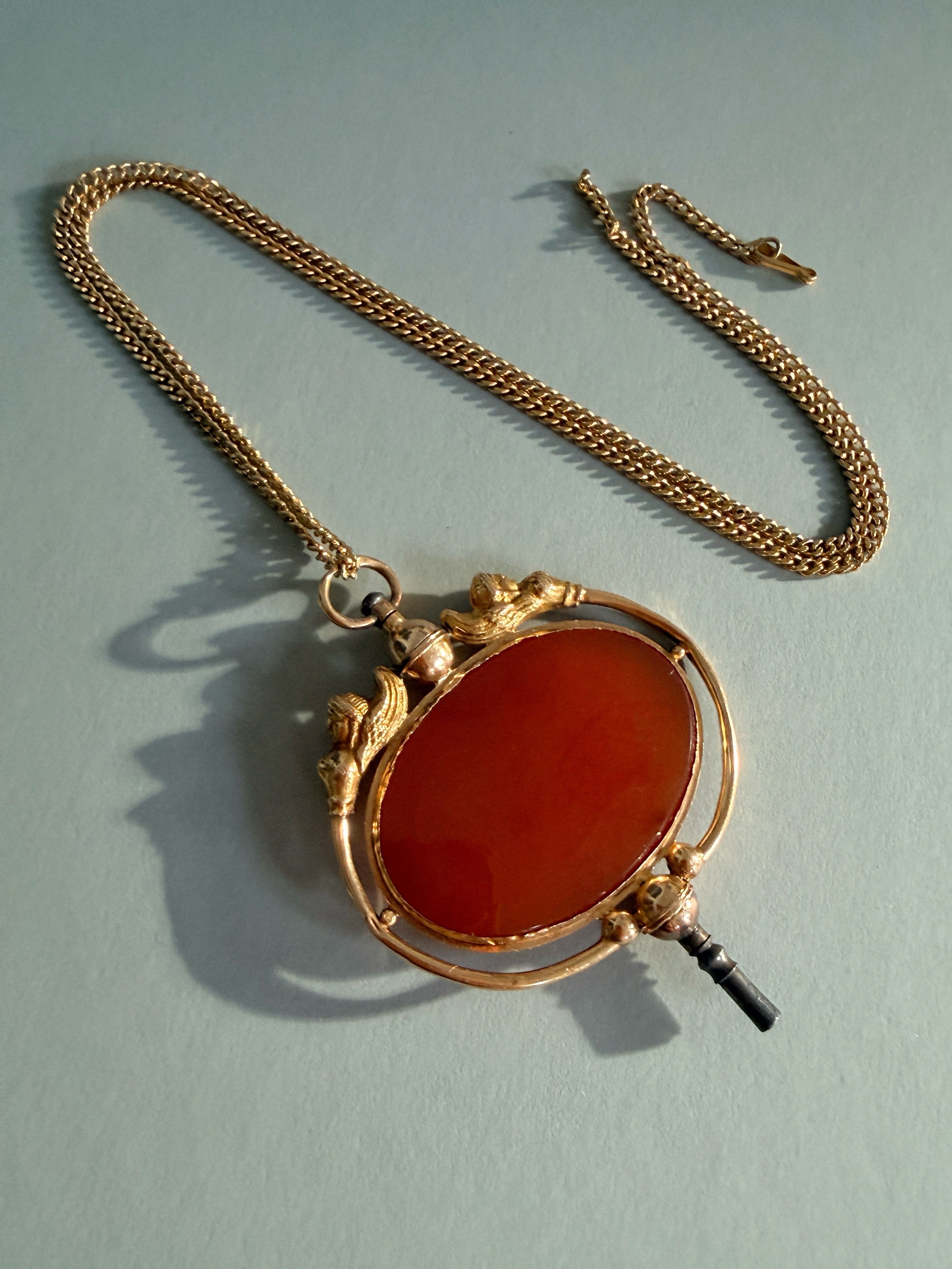 Victorian era 18K gold Egyptomania cornelian watch key pendant