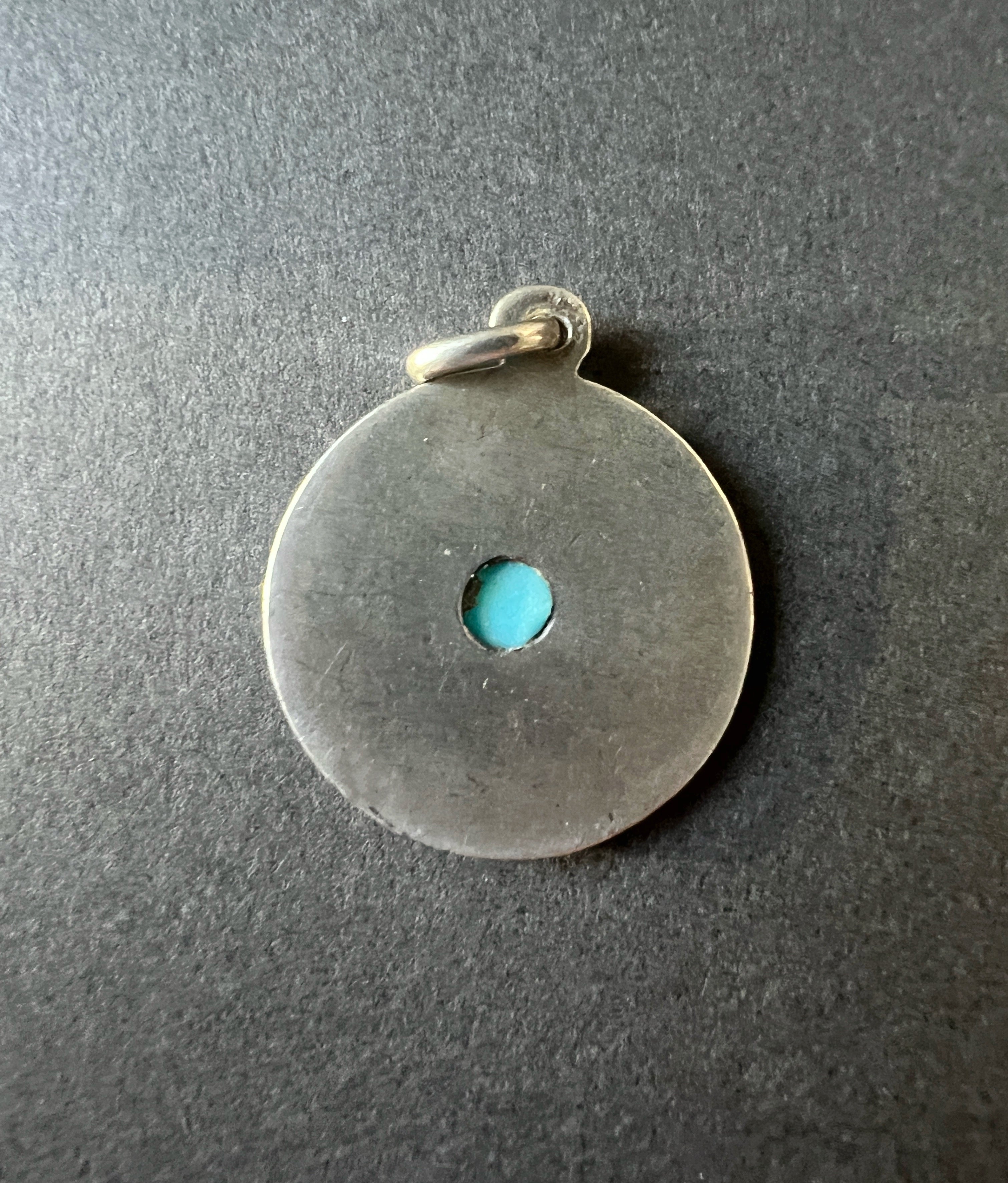 Antique French “February Happiness” turquoise silver pendant