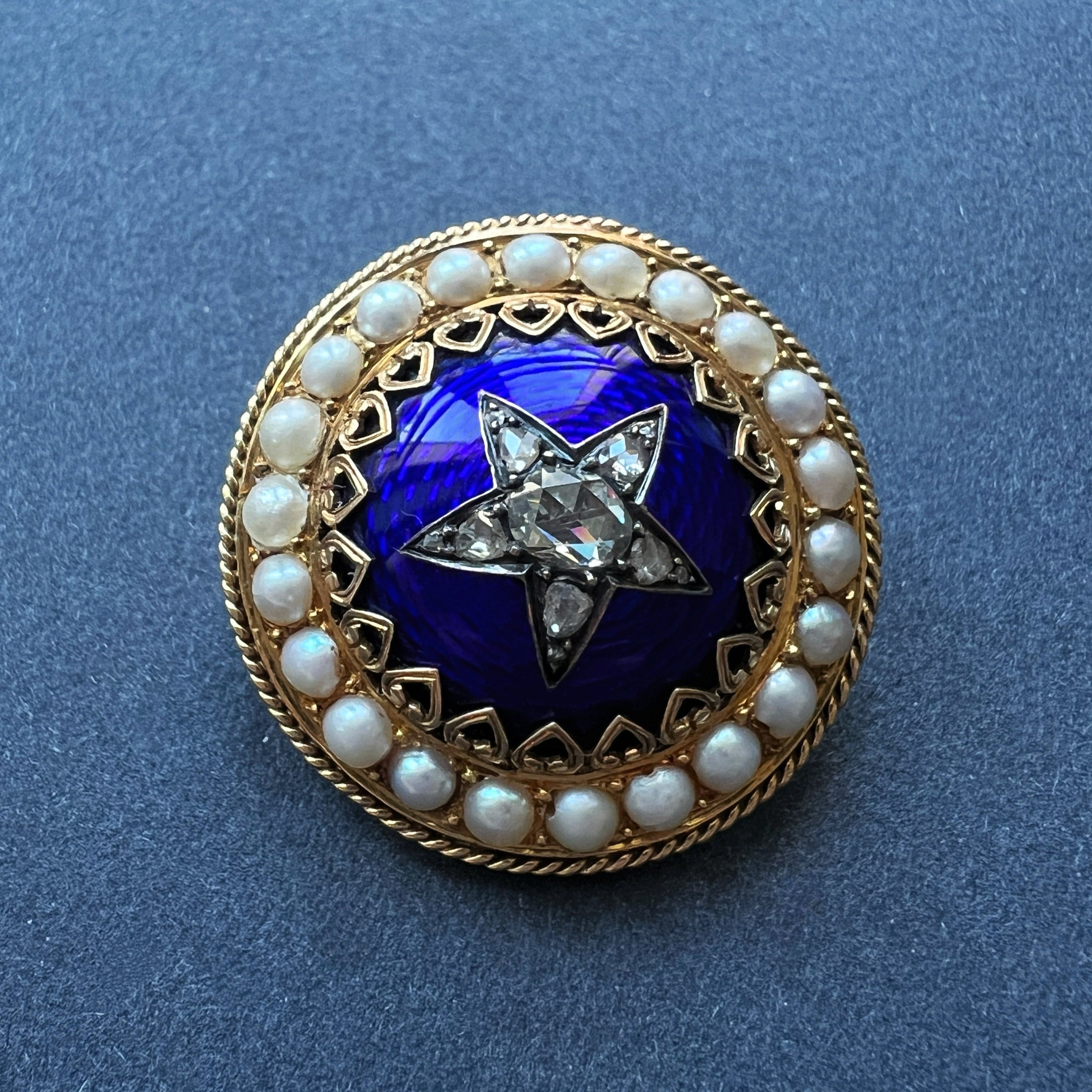 Victorian 18K gold diamond star blue enamel brooch