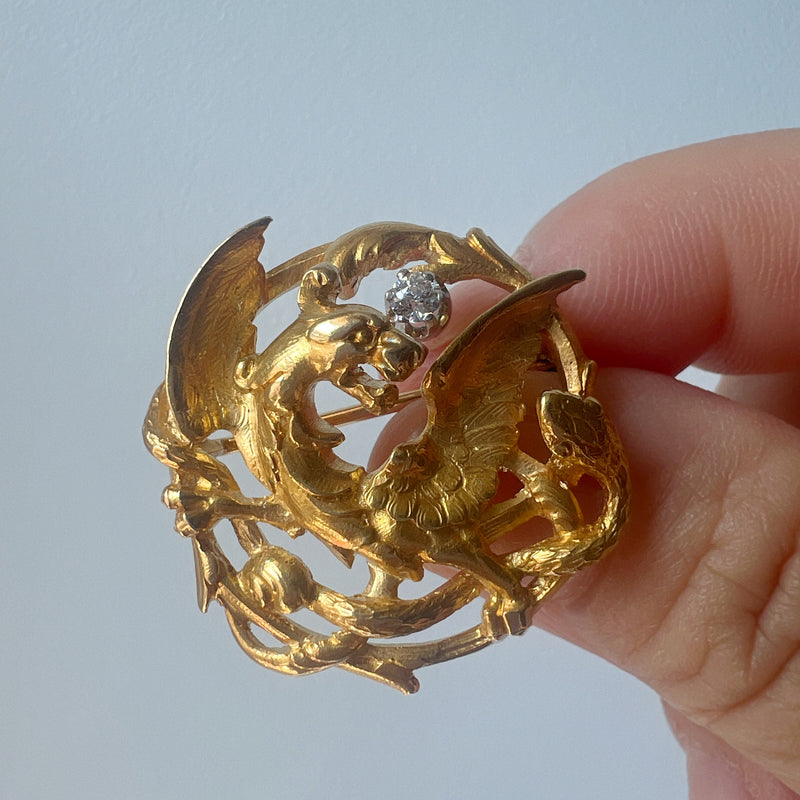 French Art Nouveau 18K gold chimera battling snake brooch