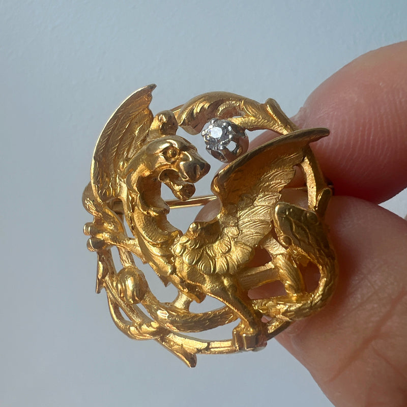 French Art Nouveau 18K gold chimera battling snake brooch