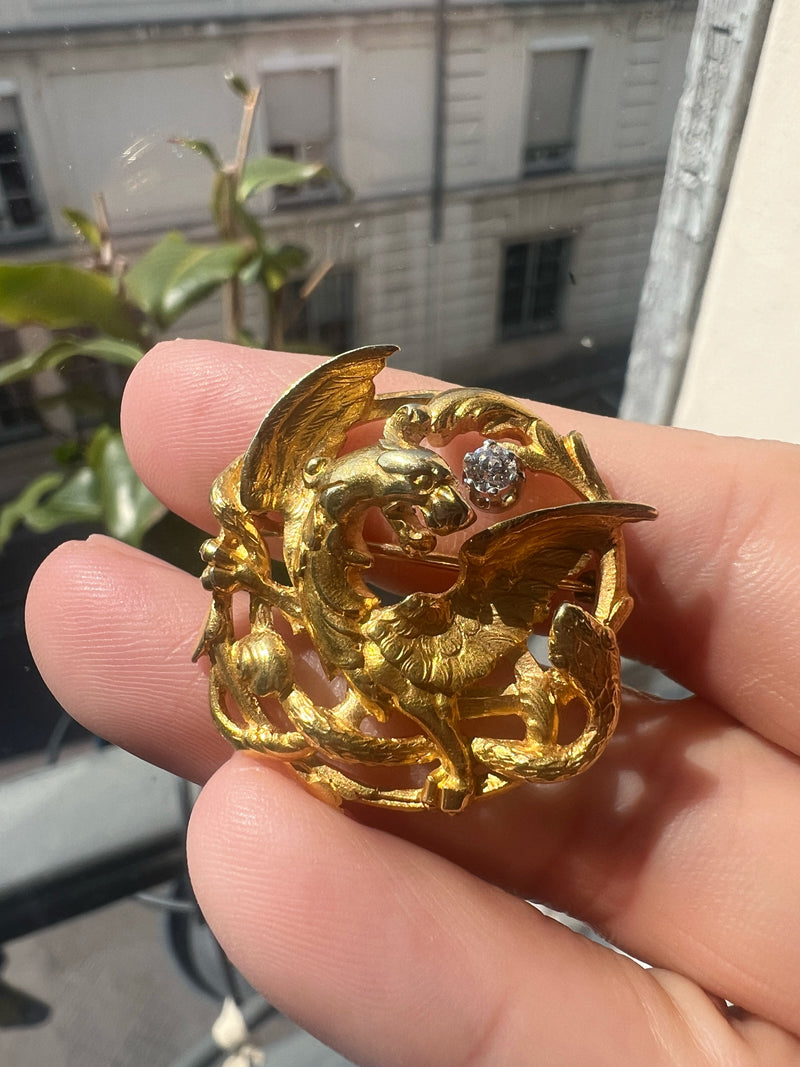 French Art Nouveau 18K gold chimera battling snake brooch