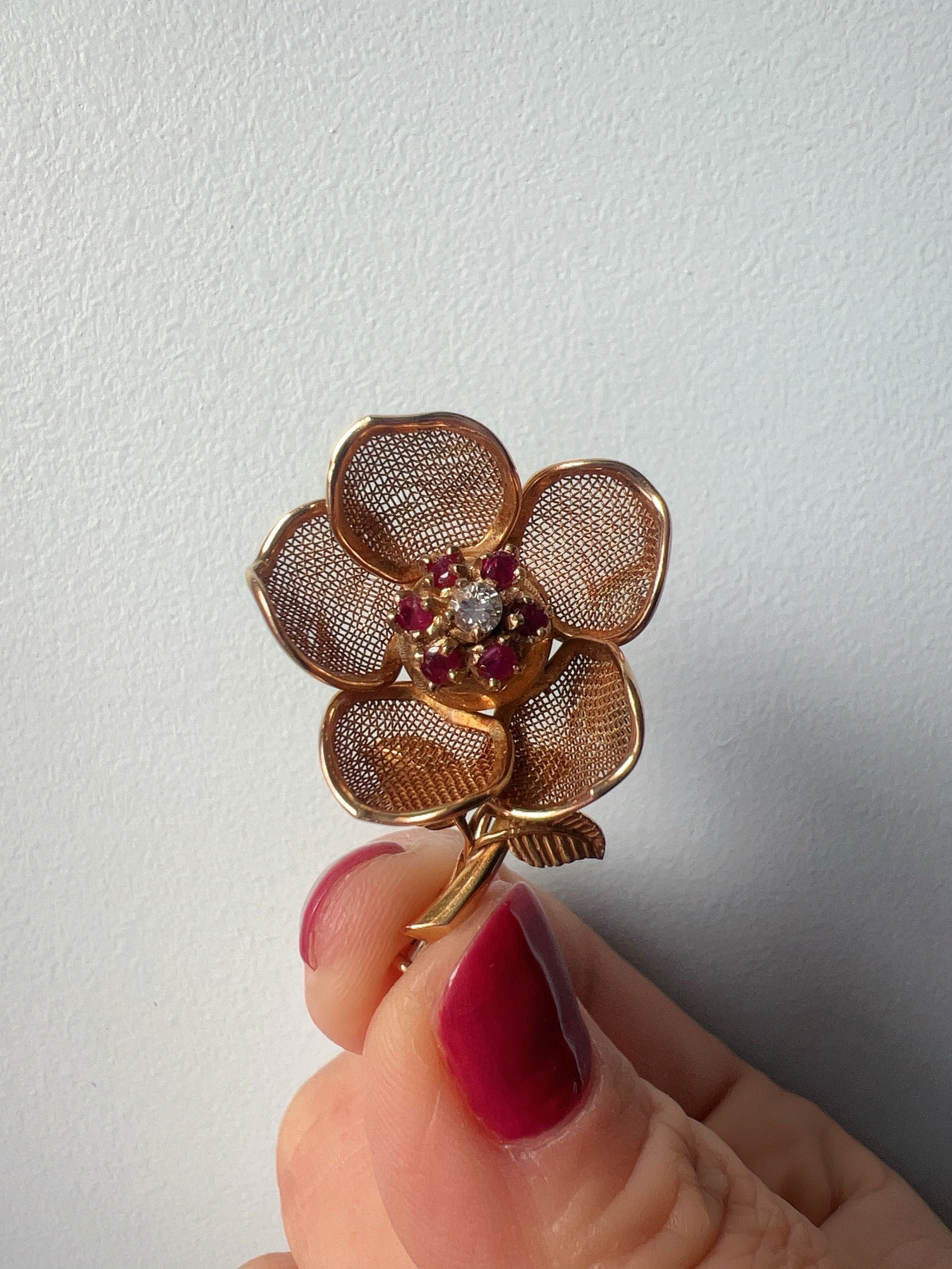 Vintage 18K gold opening rose brooch with articulated petals