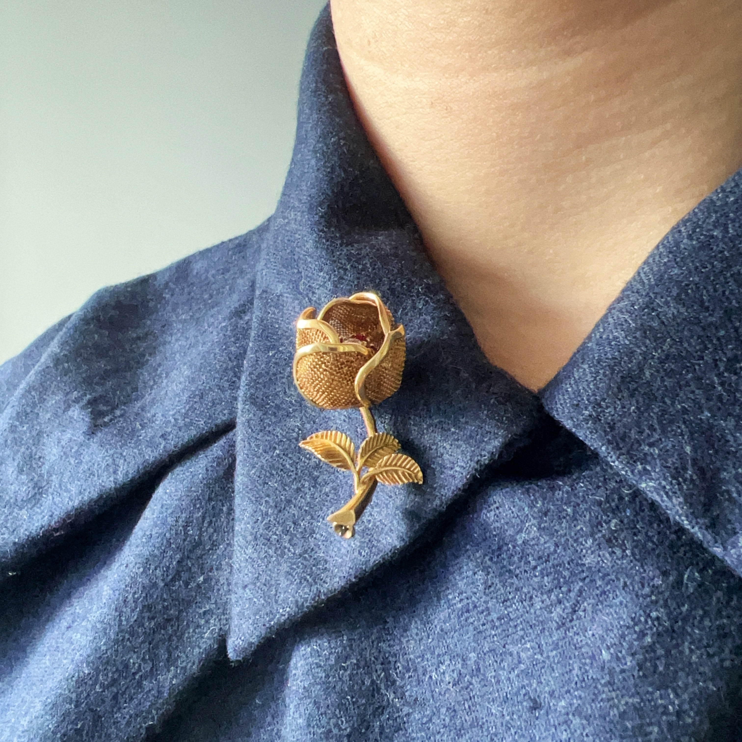 Vintage 18K gold opening rose brooch with articulated petals