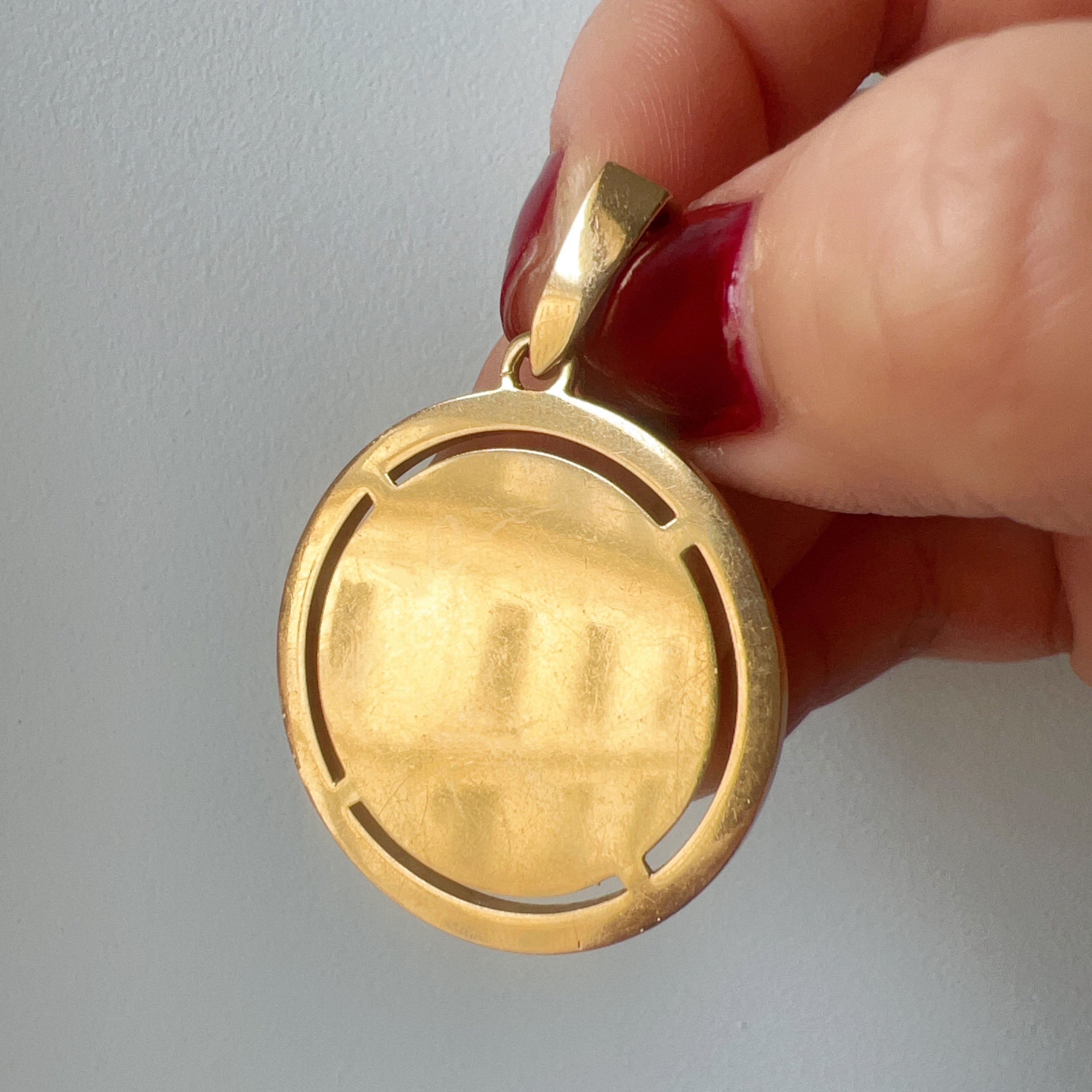 Large Augis 18K gold “more than yesterday less than tomorrow” pendant