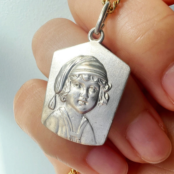 Antique silver young child portrait pendant