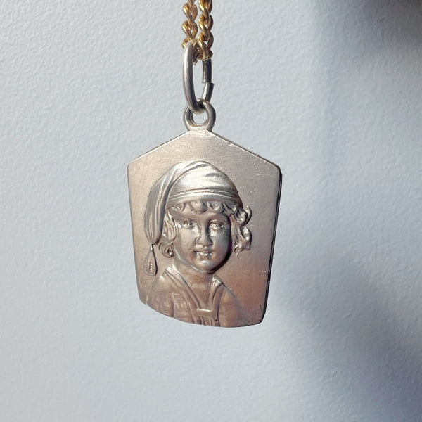 Antique silver young child portrait pendant