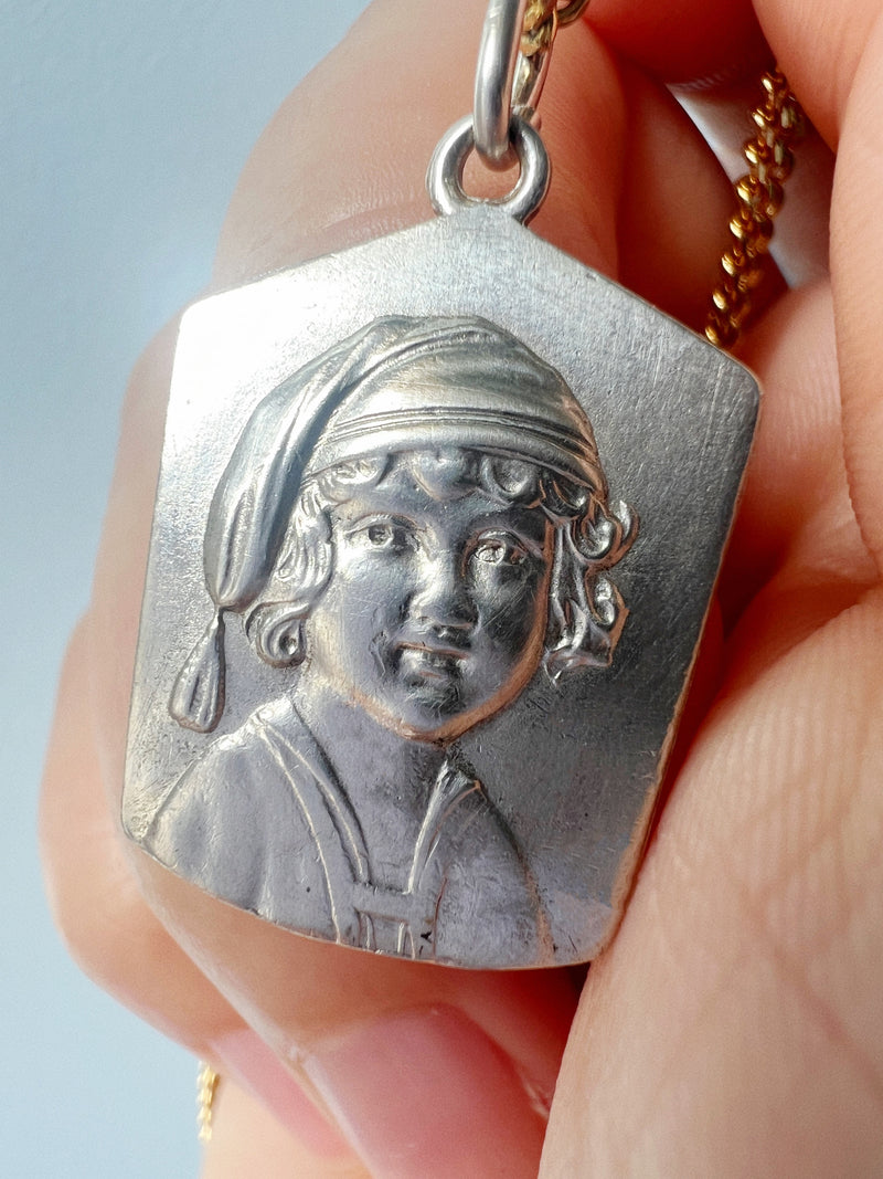 Antique silver young child portrait pendant