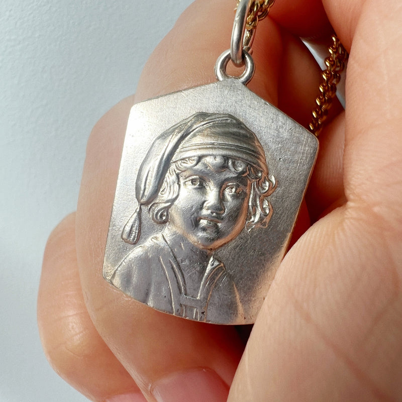 Antique silver young child portrait pendant