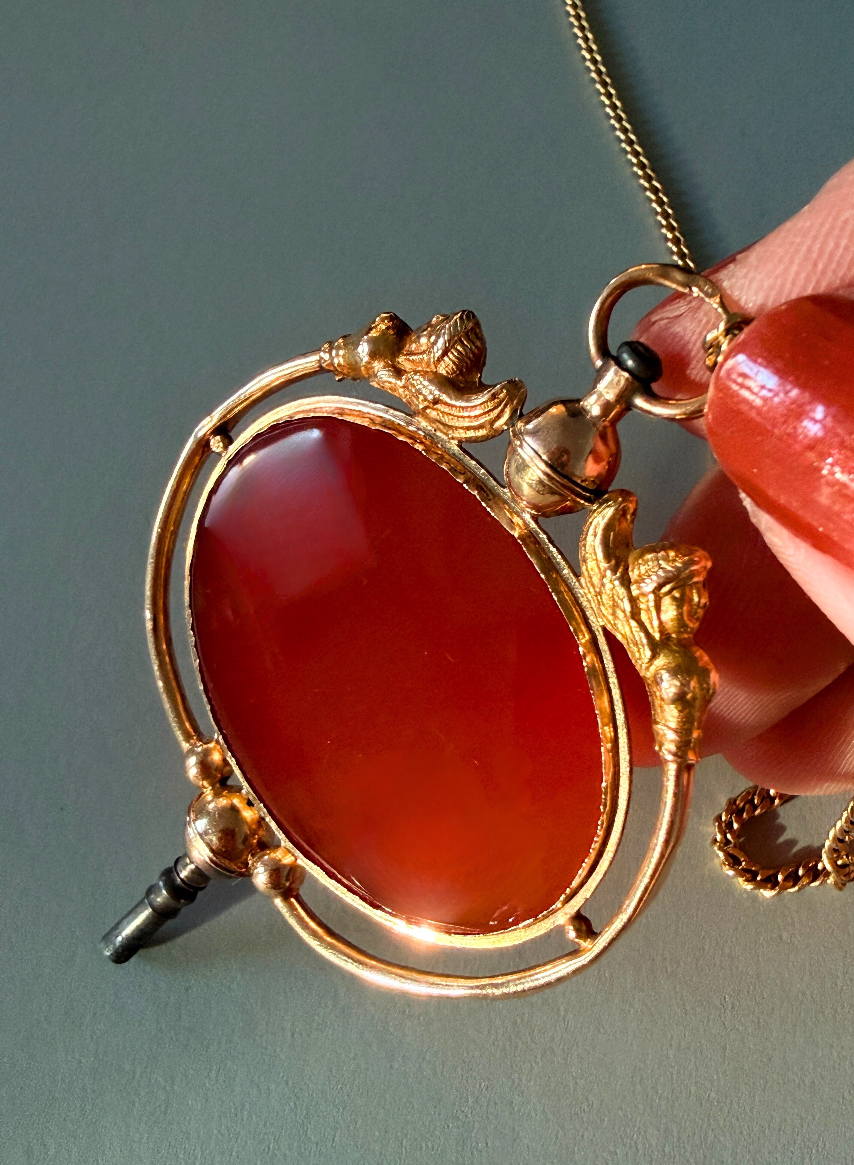 Victorian era 18K gold Egyptomania cornelian watch key pendant