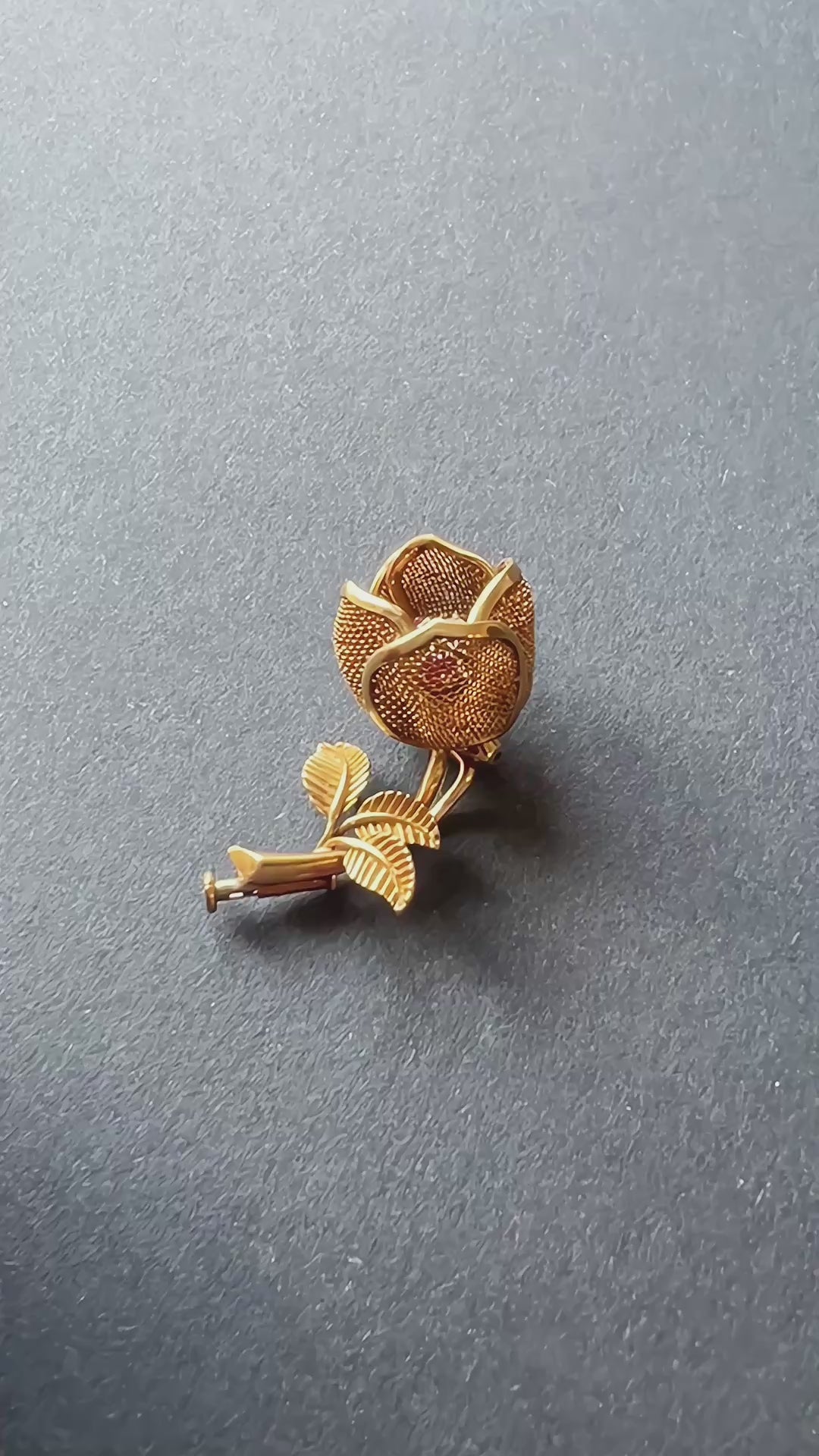 Vintage 18K gold opening rose brooch with articulated petals