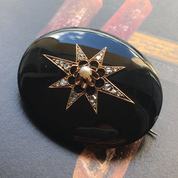 Elegant Victorian era gold diamond pearl onyx star locket brooch