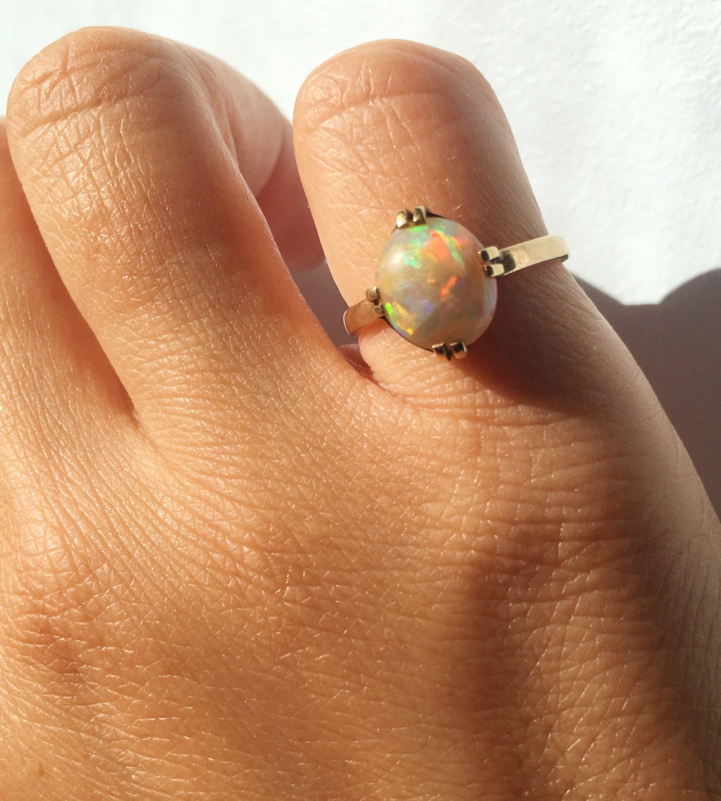 Magic rainbow 14k yellow gold opal cabochon solitaire ring - Curiously timeless