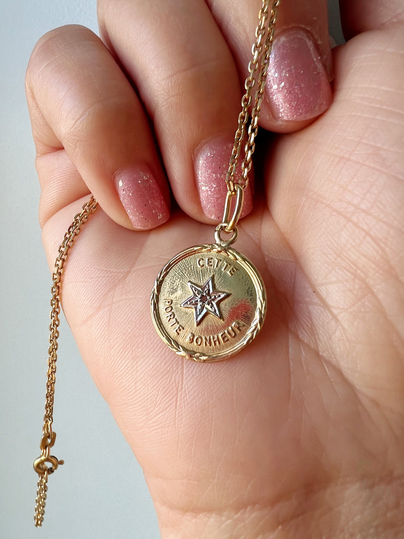 French 1920s 18K diamond star medal pendant « this star brings happiness”