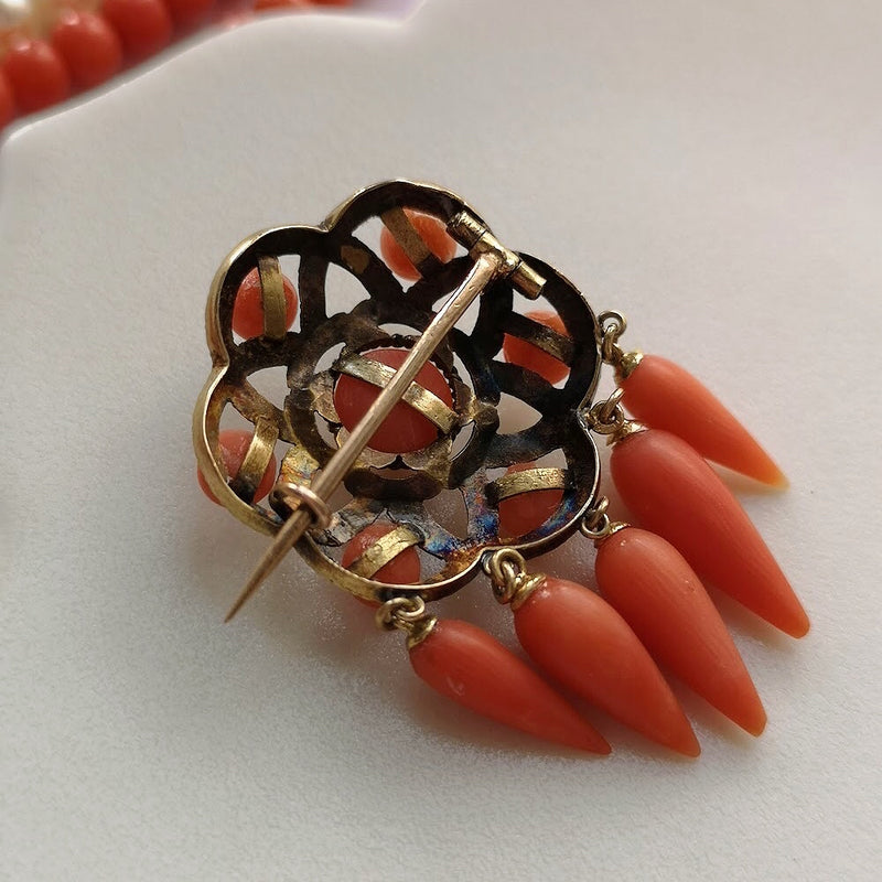 Antique 18k gold coral star brooch