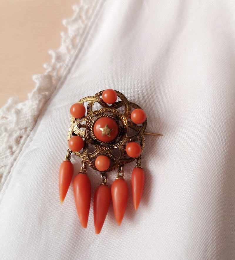 Antique 18k gold coral star brooch