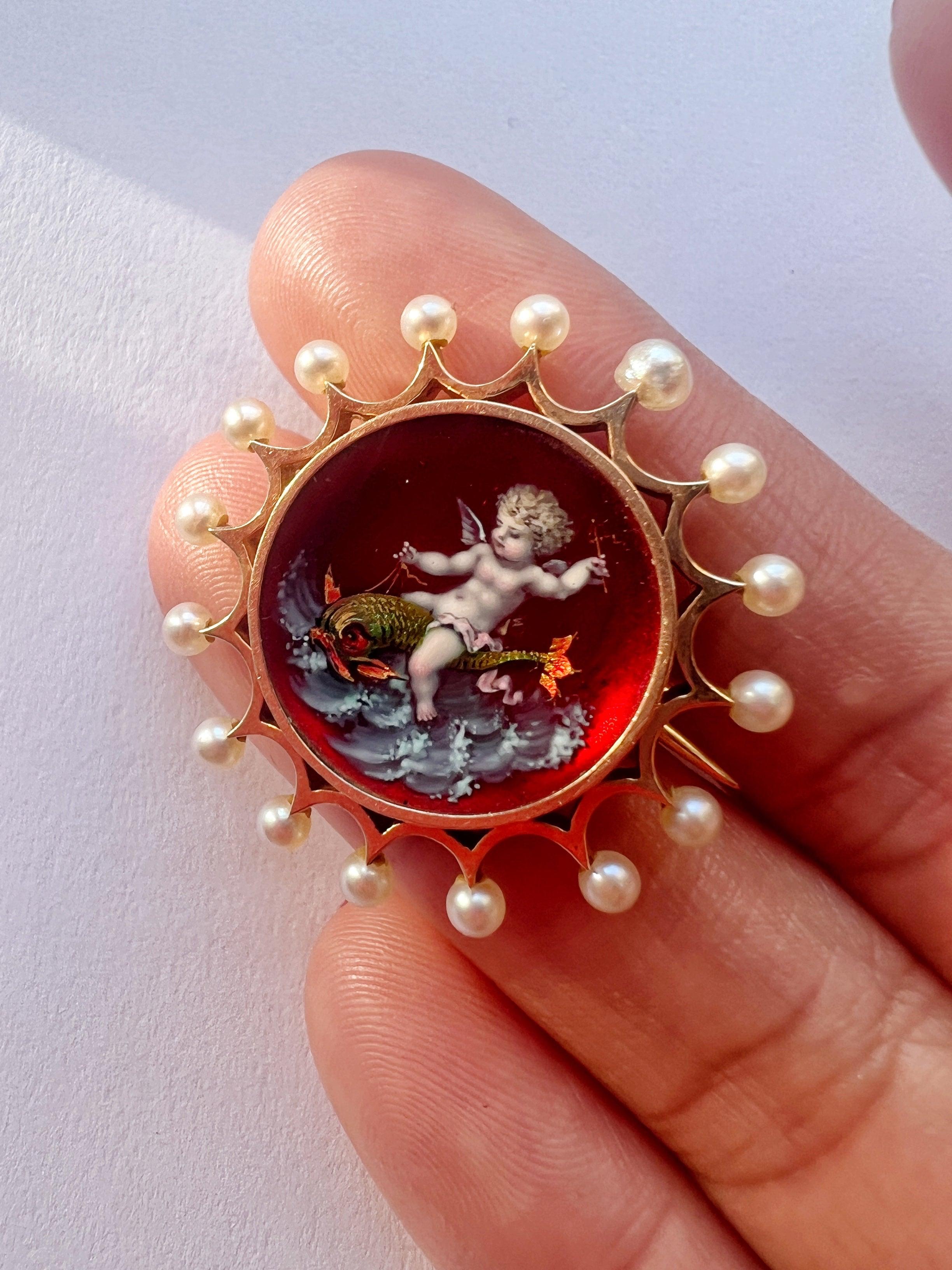 Victorian era 18K gold pearl enamel cupid riding a dolphin brooch - Curiously timeless