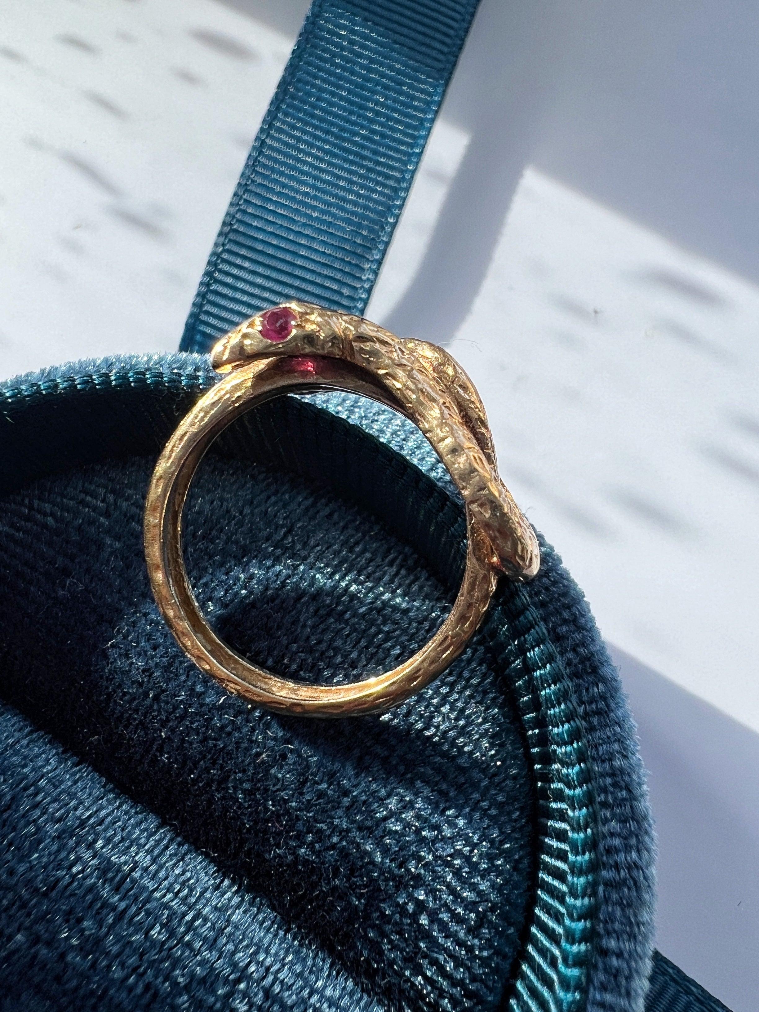 Chiseled 18k yellow plain gold twisted snake ring with ruby eyes - Curiously timeless