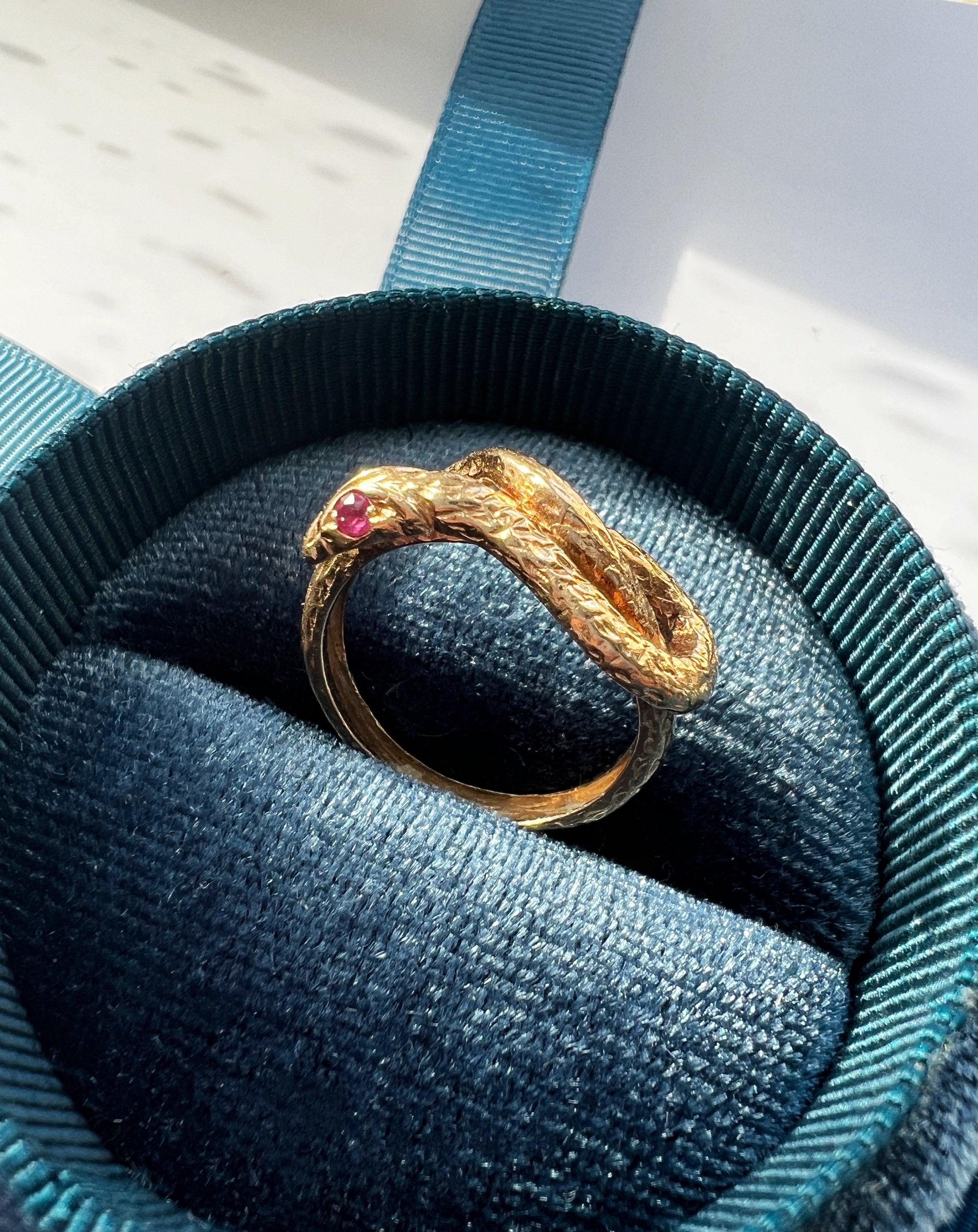 Chiseled 18k yellow plain gold twisted snake ring with ruby eyes - Curiously timeless