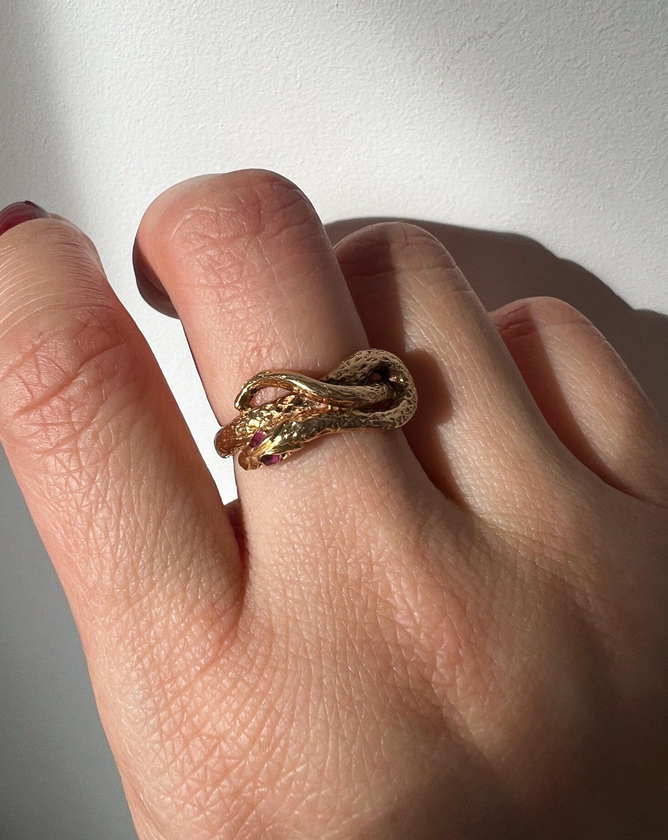 Chiseled 18k yellow plain gold twisted snake ring with ruby eyes - Curiously timeless