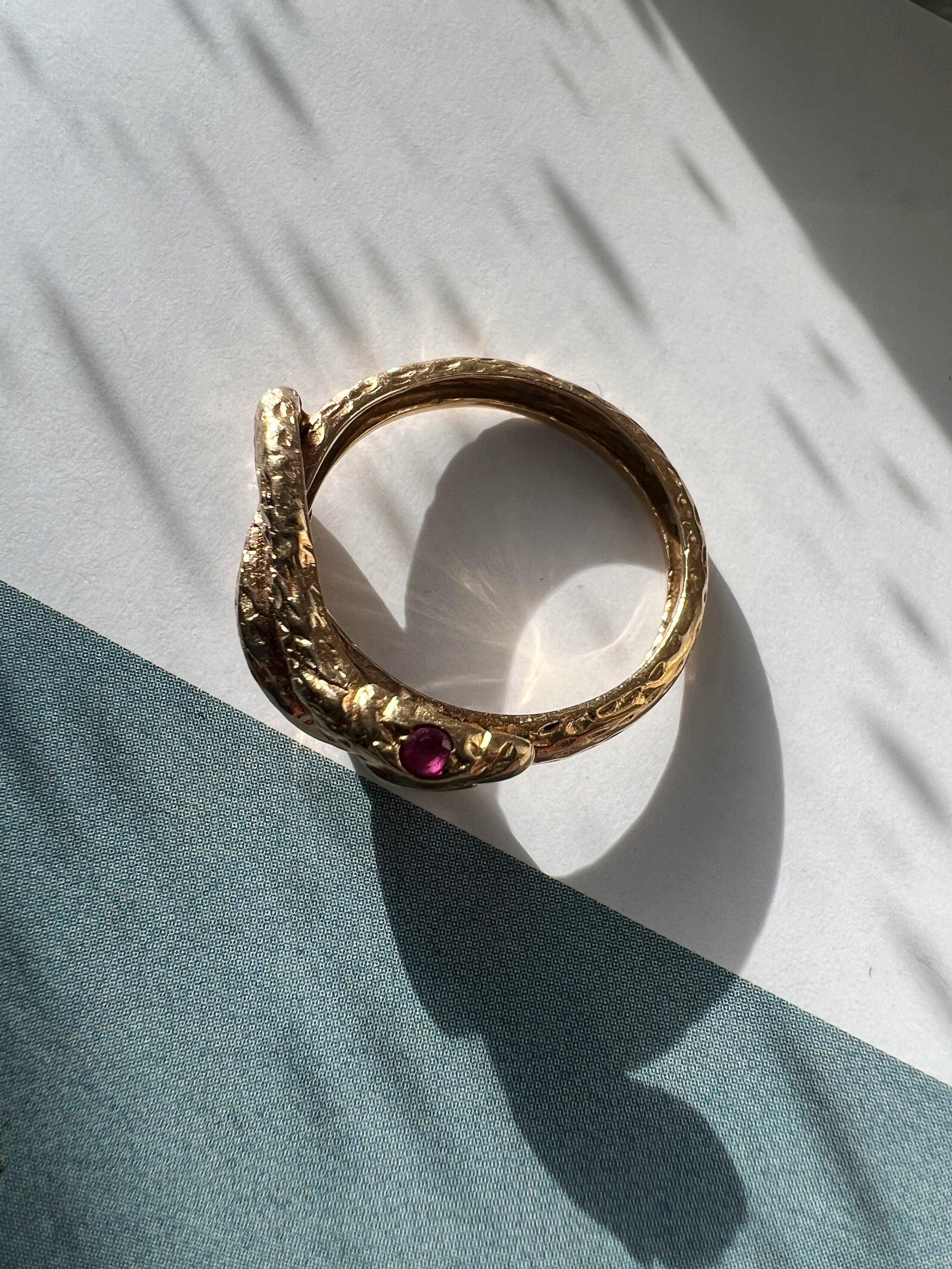 Chiseled 18k yellow plain gold twisted snake ring with ruby eyes - Curiously timeless