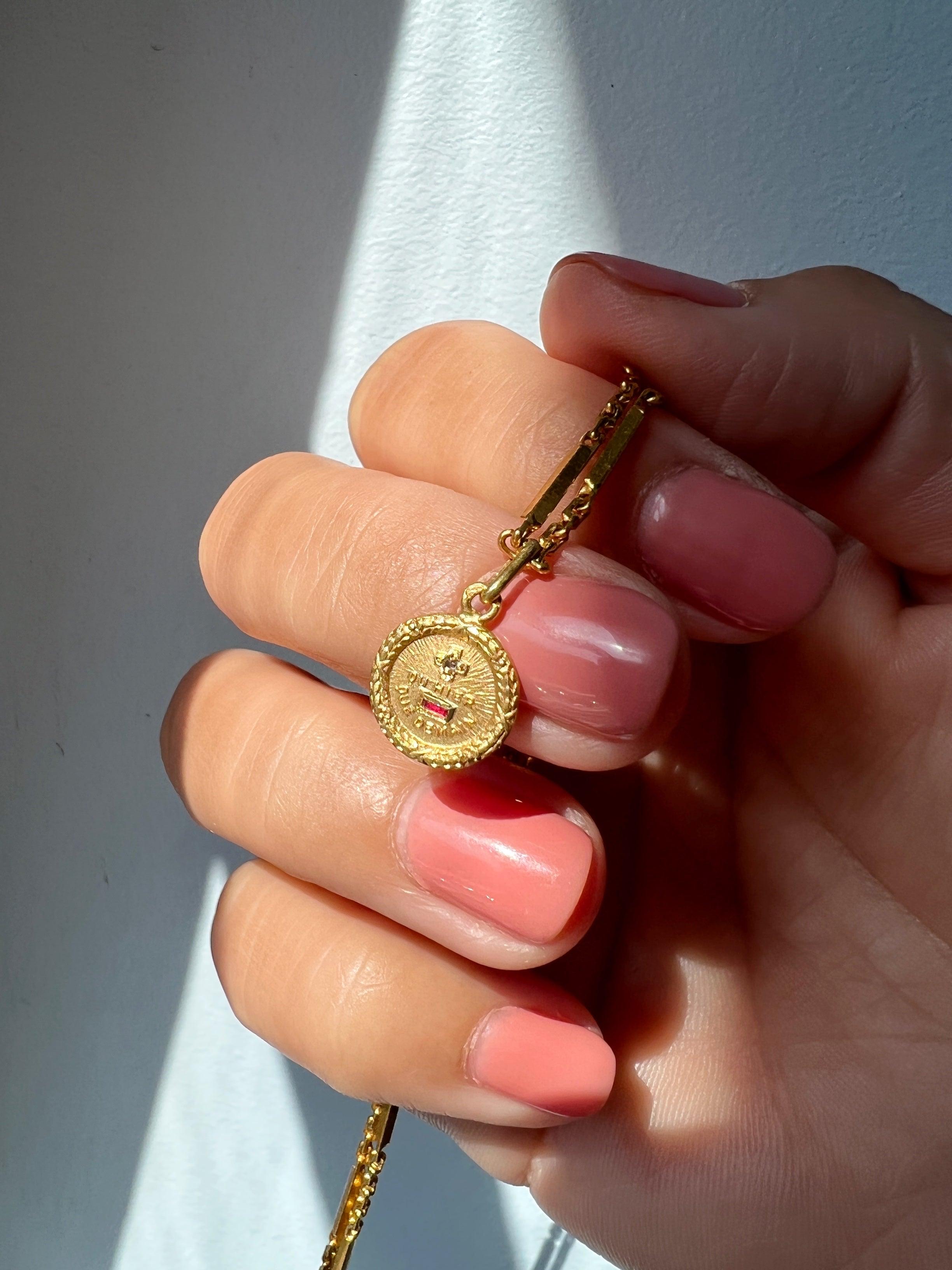 Vintage Tiny Augis 18K gold love medal pendant - Curiously timeless